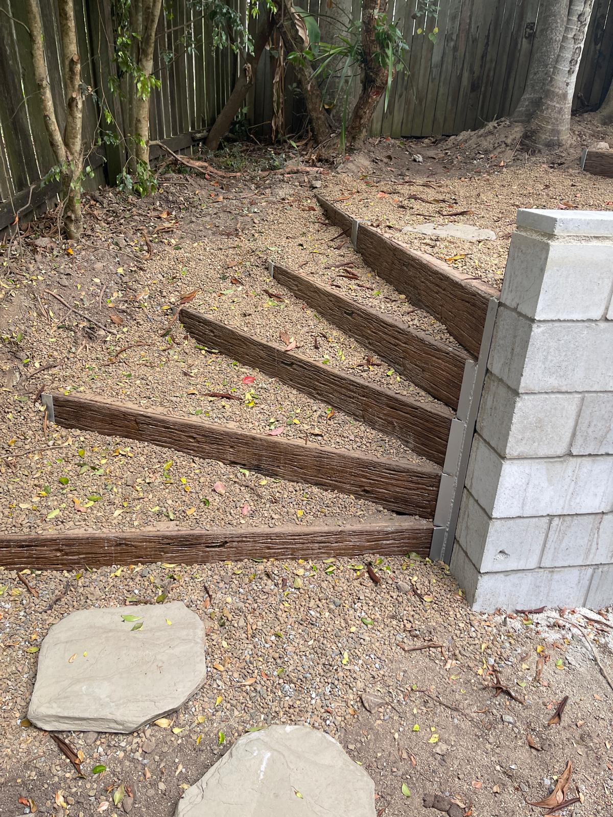 Terraced gravel steps retained with concrete sleepers